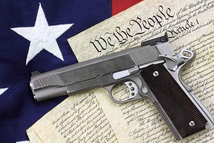 Gun on U.S. Constitution and flag.