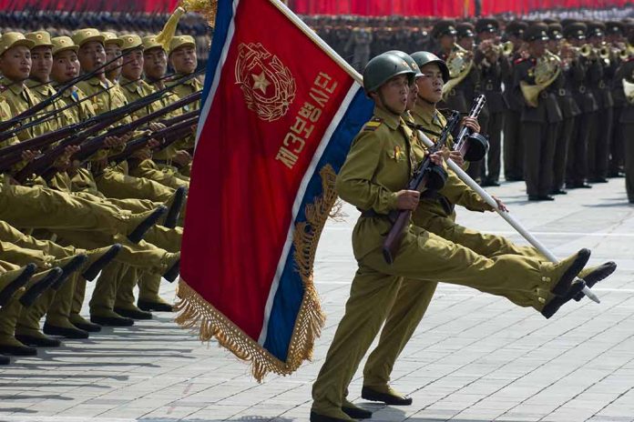 Soldiers marching with flag in military parade