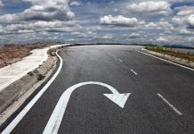 Curved road with a U-turn arrow