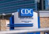 CDC building sign in front of structure.