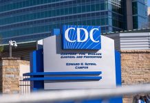 CDC building sign in front of structure.