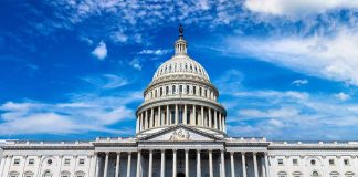 U.S. Capitol building with clear blue sky background.