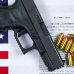 Gun and bullets on Second Amendment document.