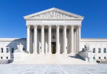 United States Supreme Court building under clear blue sky