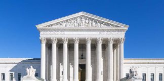 United States Supreme Court building under clear blue sky