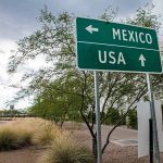 Directional sign for Mexico and USA.