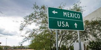 Directional sign for Mexico and USA.