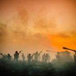 Soldiers and tanks in the foggy battlefield.