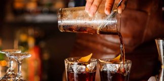 Bartender pouring cocktails