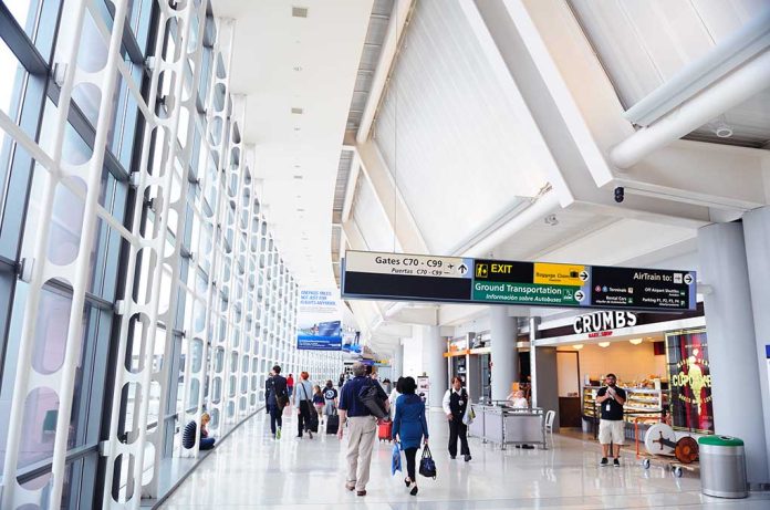 People walking in a brightly lit airport terminal