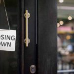 closing down sign on a shop door.