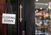 closing down sign on a shop door.