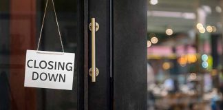 closing down sign on a shop door.