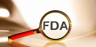 FDA under magnifying glass gold background