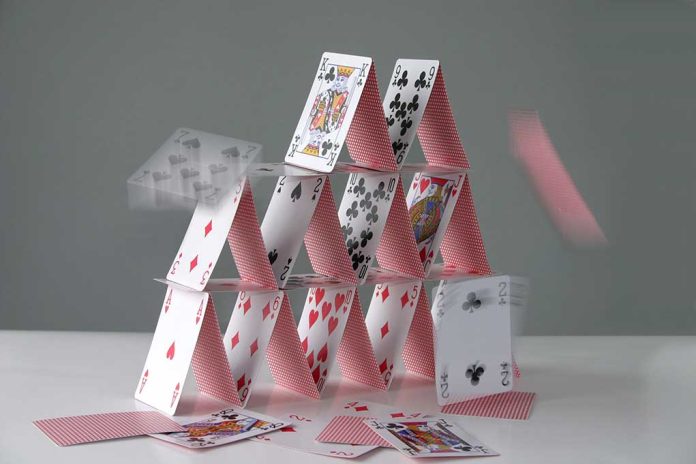 Collapsing house of cards in motion.