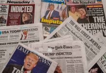 Newspaper headlines about Trump indictment and charges.