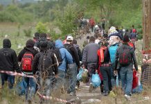 Group of people walking on a rural path