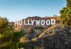 Hollywood sign on a hill with trees.