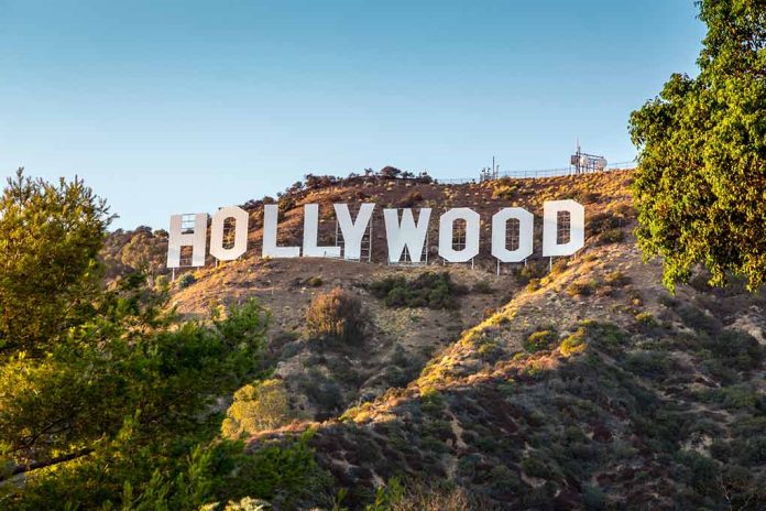 Hollywood sign on a hill with trees.