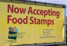 Yellow sign now accepting food stamps EBT SNAP