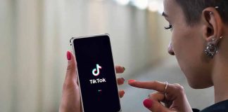 Person using TikTok app on smartphone