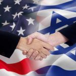 Handshake with USA and Israel flags background.