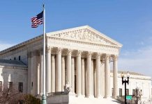 United States Supreme Court building with American flag