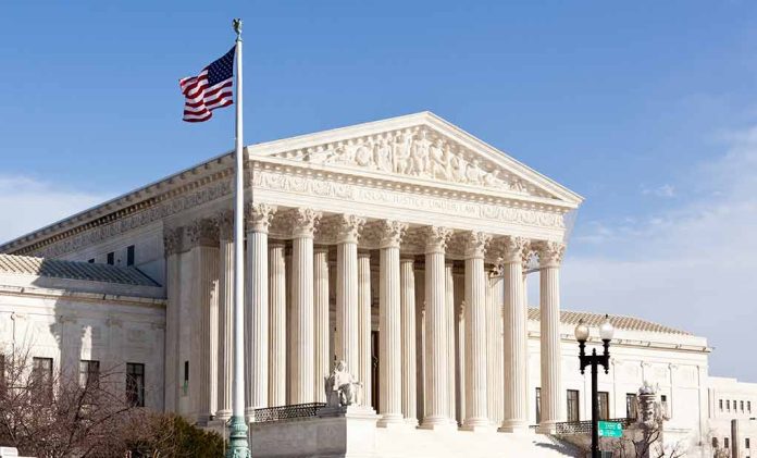 United States Supreme Court building with American flag